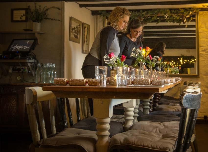 Preparing the tables for Christmas in a pub restaurant